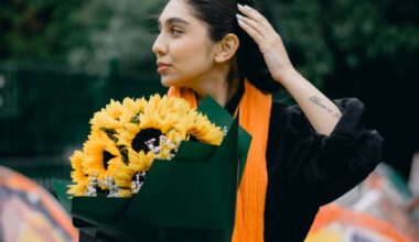 woman holding sunflowers outdoors in iran