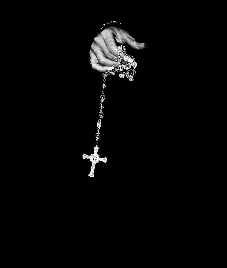 crop woman with cross on chain