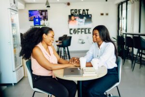 happy women enjoying coffee at lagos cafe
