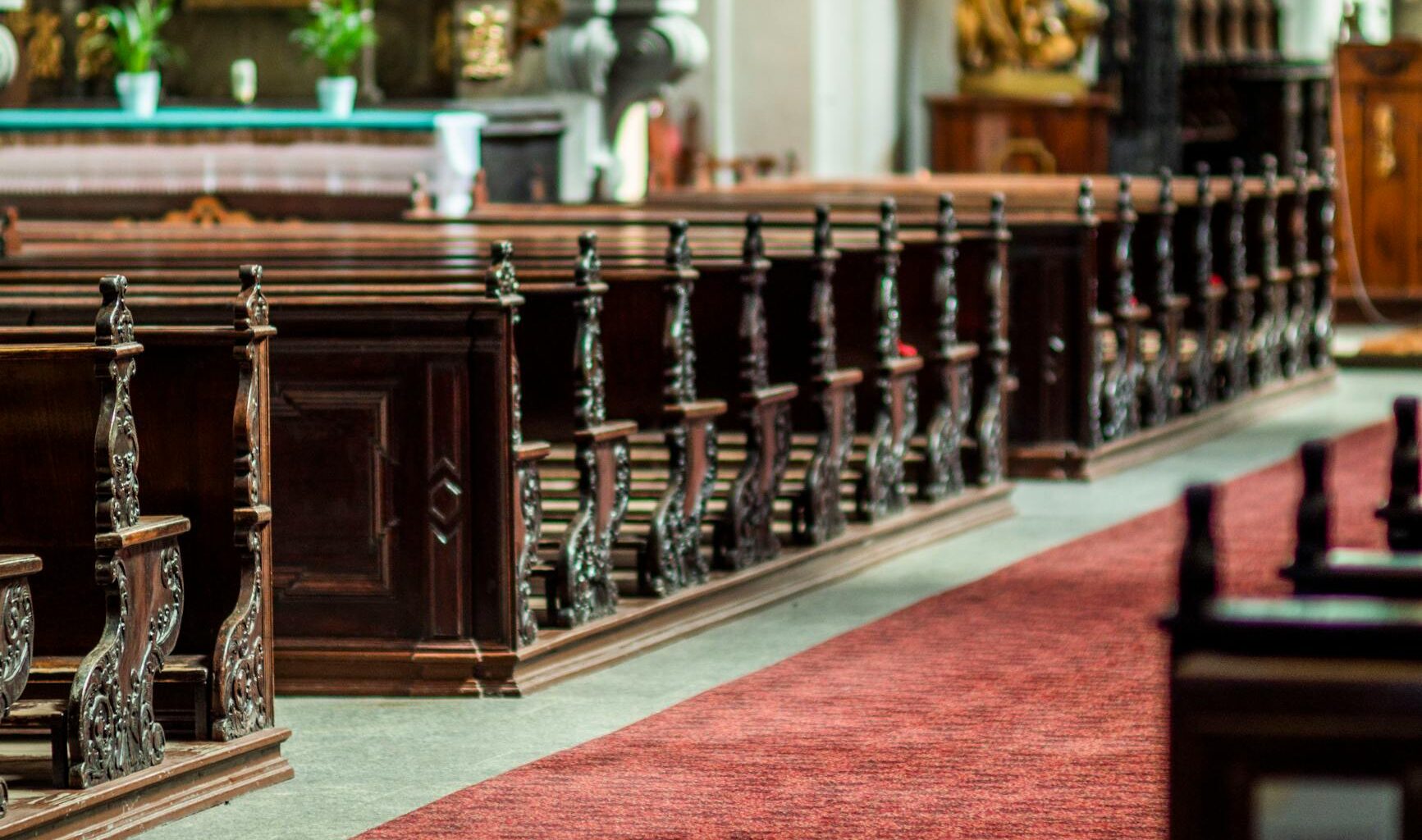 elegant church interior with wooden pews