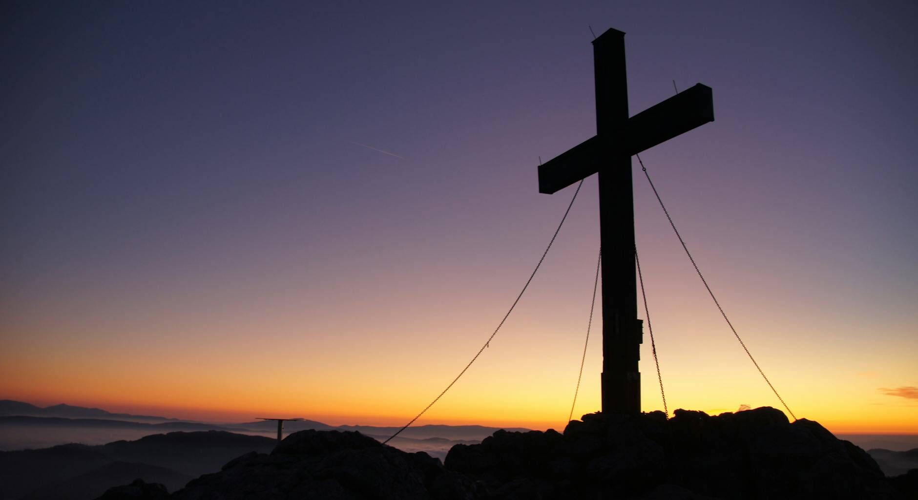 cross silhouette during golden hour