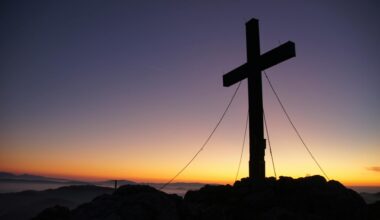 cross silhouette during golden hour