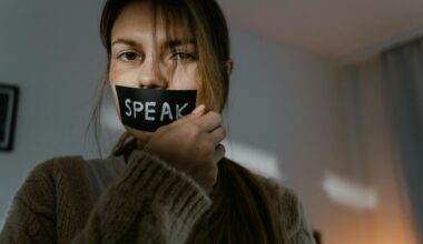 woman holding the black tape on her lips