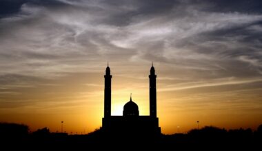 silhouette of mosque below cloudy sky during daytime