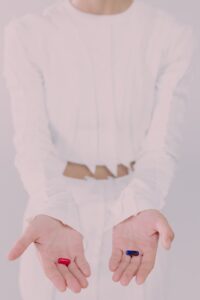 woman holding pills