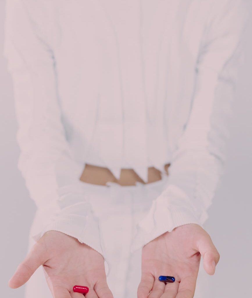 woman holding pills
