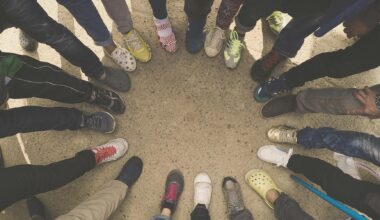 group of people standing on pavement
