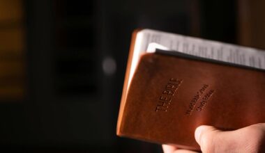 a person holding brown bible