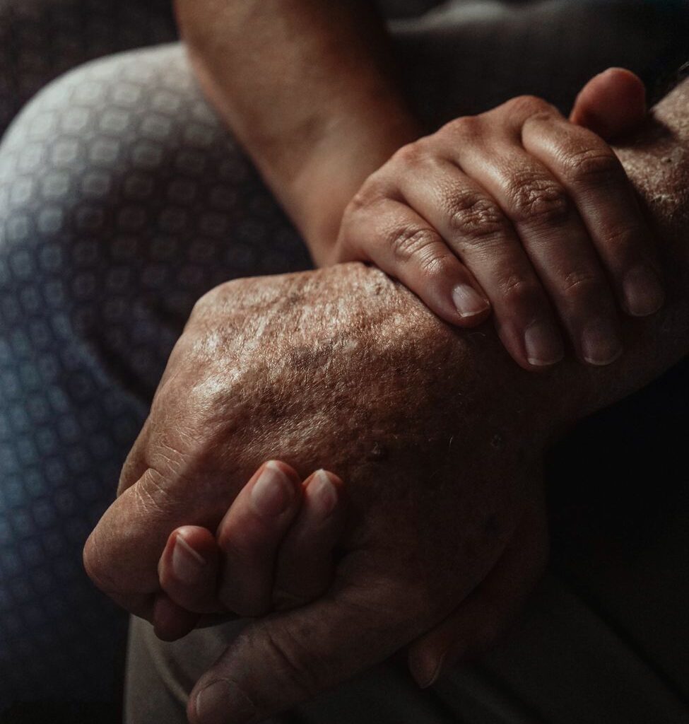 a close up shot of people holding hands