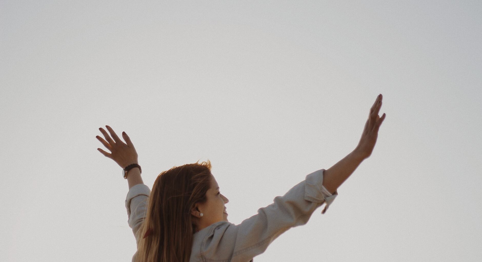 woman with her arm s raised