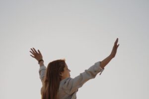 woman with her arm s raised