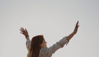 woman with her arm s raised