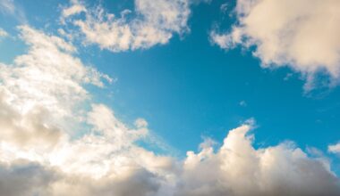 vibrant blue sky with fluffy clouds