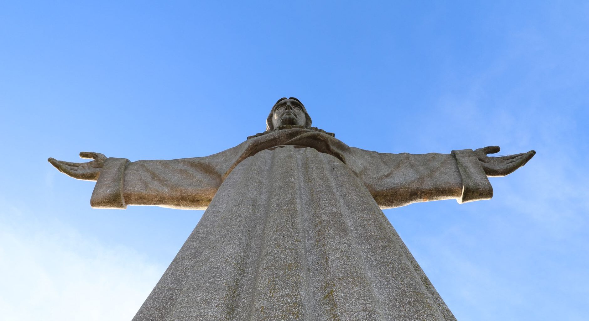 christ the king statue against clear blue sky