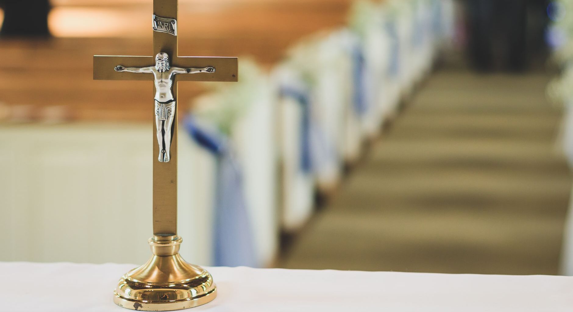 brown and silver cross table decor