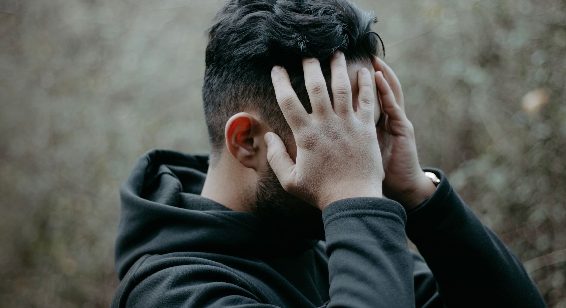 a man holding his head