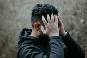 a man holding his head
