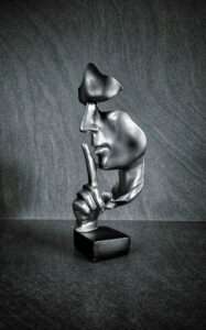 modern abstract sculpture of a silenced face