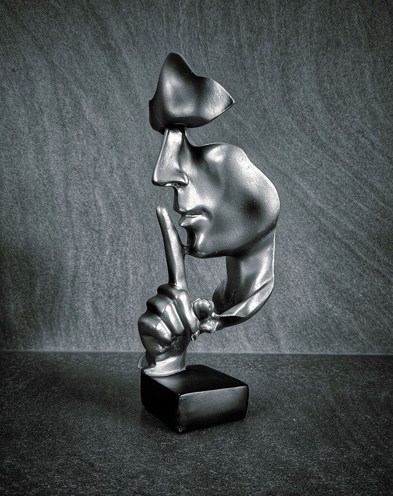 modern abstract sculpture of a silenced face