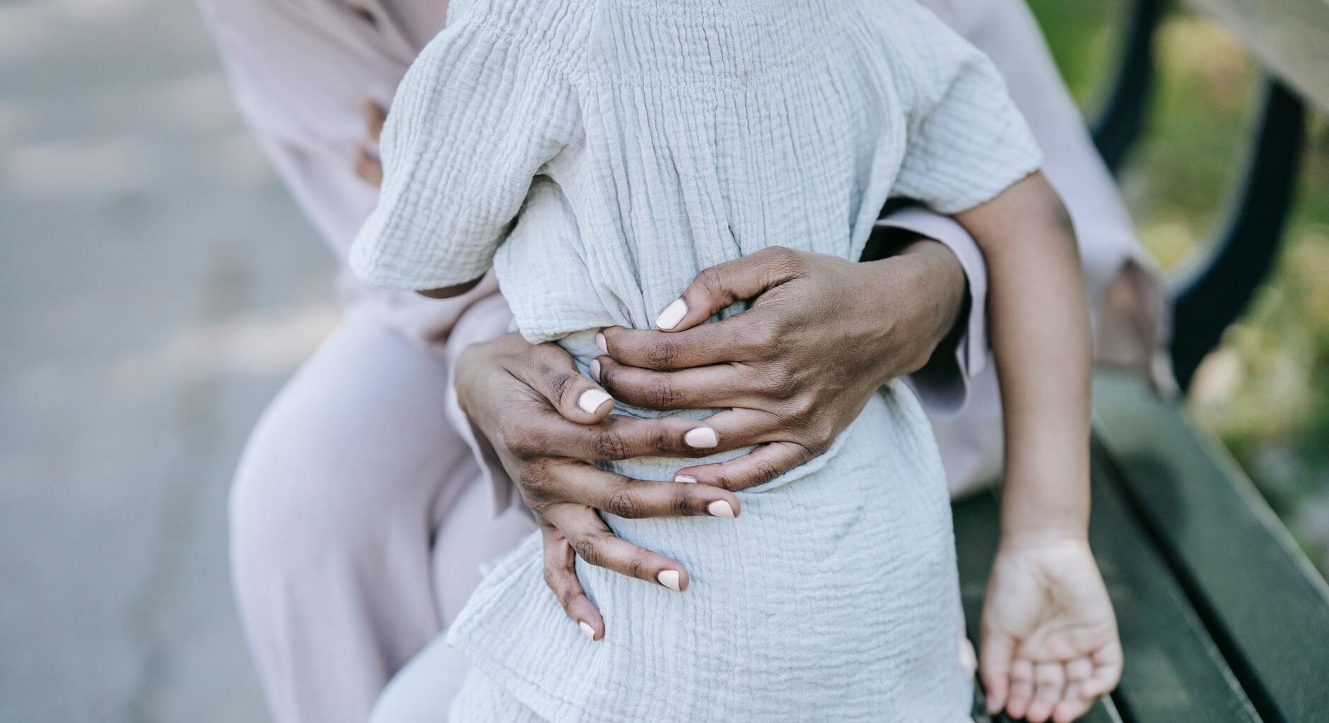 hands embracing the kid